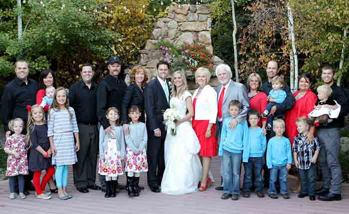 Merrill Osmond family taking group photo in Justin Marriage.